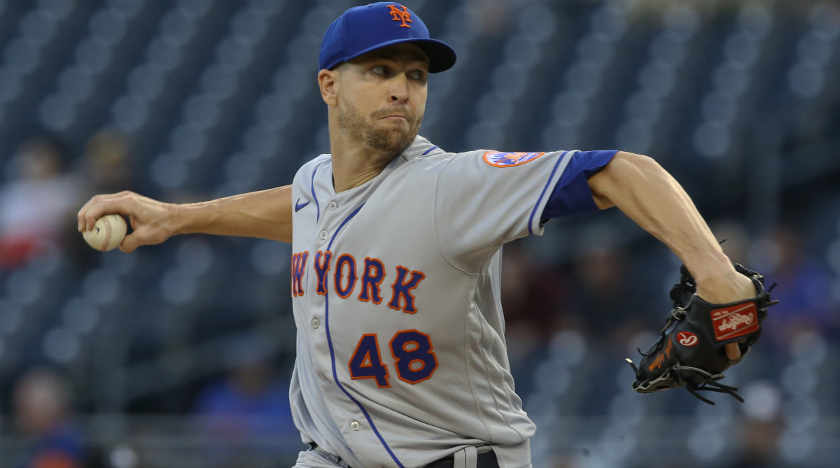 Rangers pitcher Jacob deGrom throws from the mound while with the Mets.